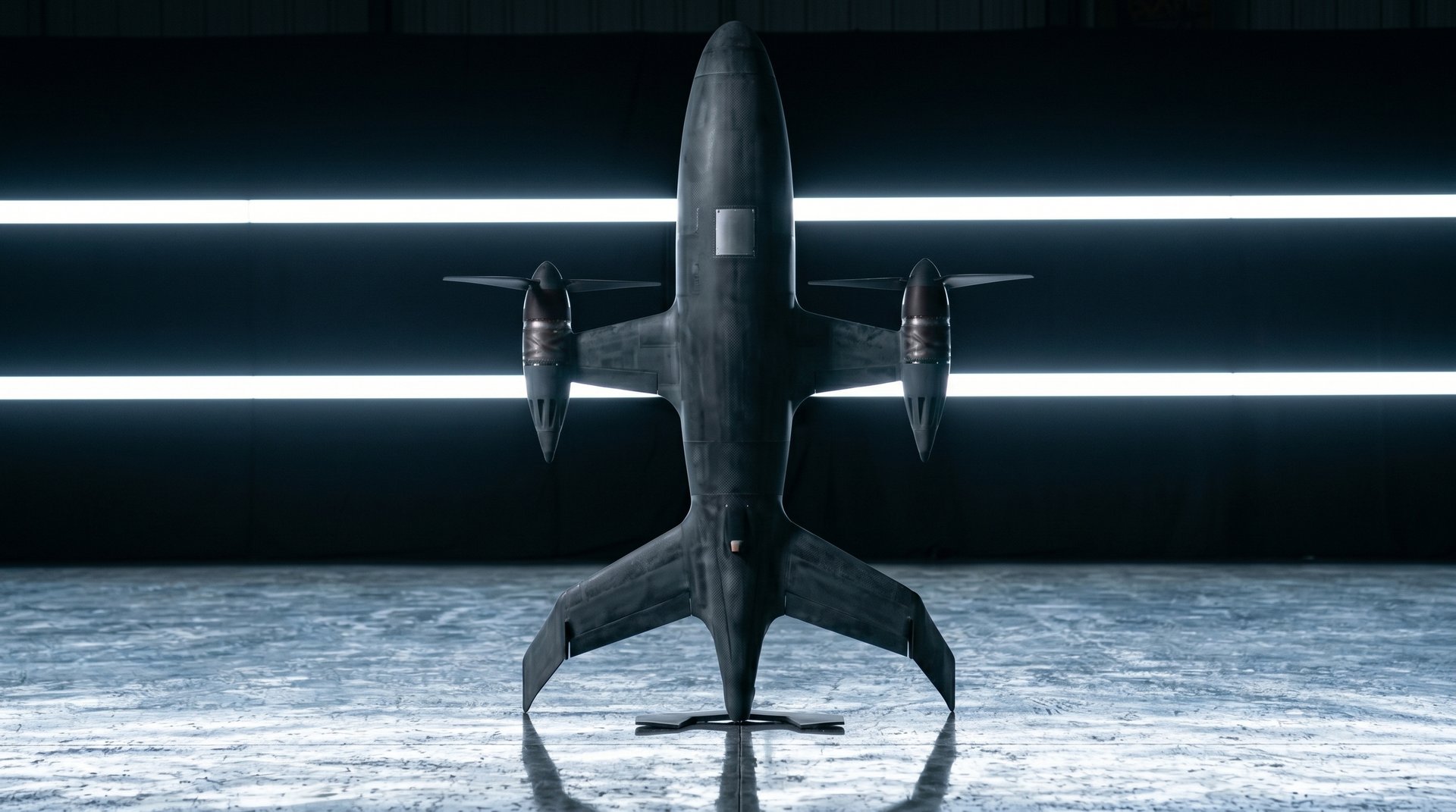Front three-quarter view of the Varn Gjall autonomous interceptor in a hangar, twin propeller nacelles outboard, swept tail visible on a polished reflective floor.